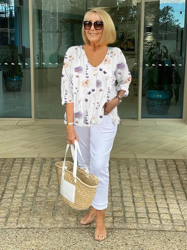 Blusa floreale con abbottonatura frontale — Blusa con scollo a V e manica a tre quarti