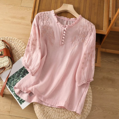 Blusa con bottoni e ricamo floreale — Blusa fluida ed elegante