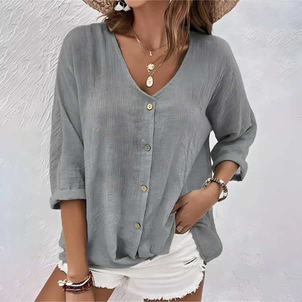 Blusa con bottoni dal taglio rilassato e scollo a V — Blusa fluida estiva