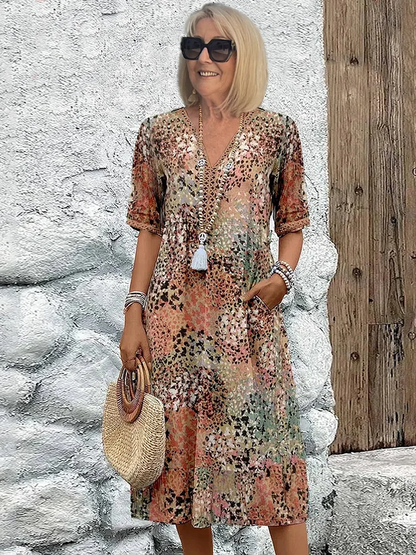 Abito midi fluido e colorato con tasche — Abito versatile estivo